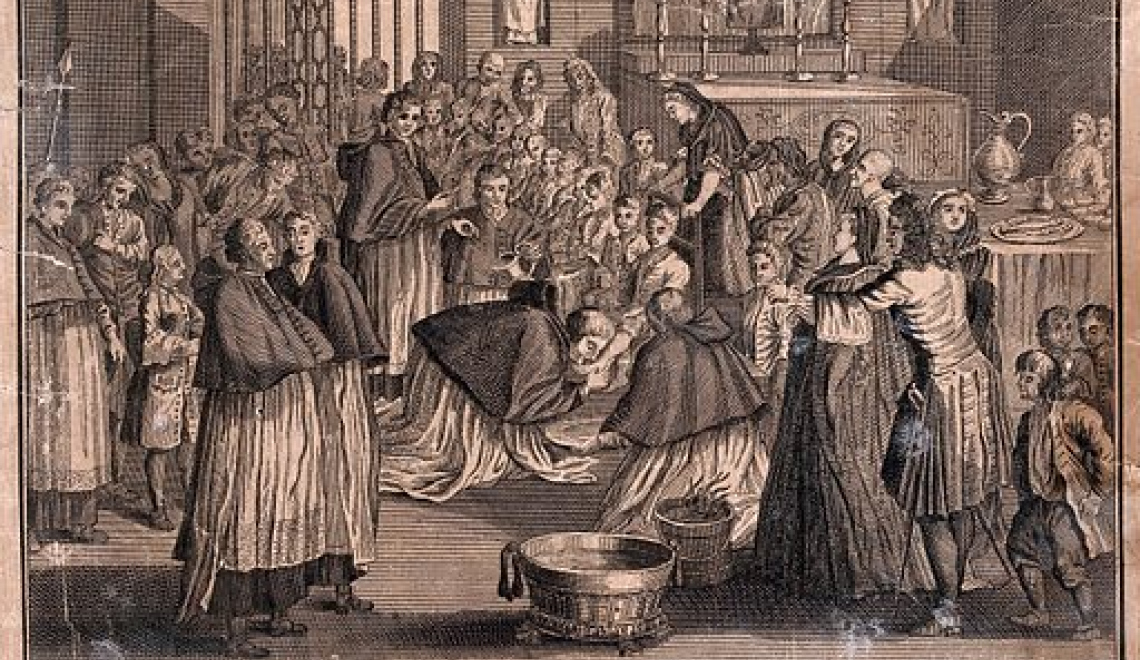 The washing of the poor men's feet by the Pope on Holy Thursday