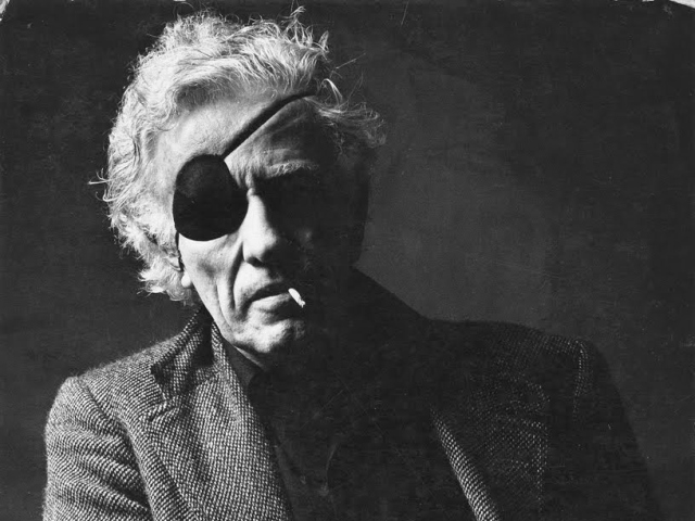 Abbildung von Nicholas Ray mit Augenklappe und Zigarette